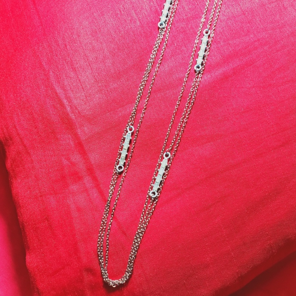 Multi chain necklace with light blue charms